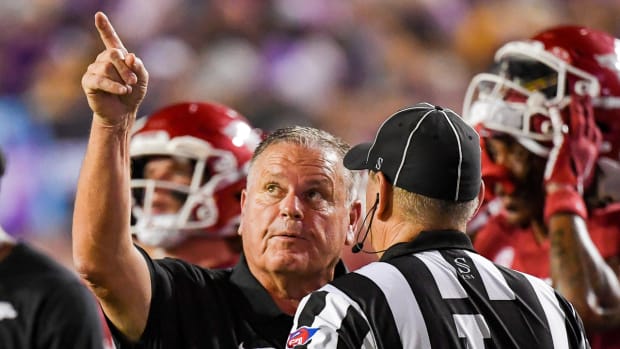 Razorbacks coach Sam Pittman pointing at replay board against LSU